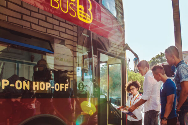 3-passengers-hopping-on-a-big-bus-tour-in-rome